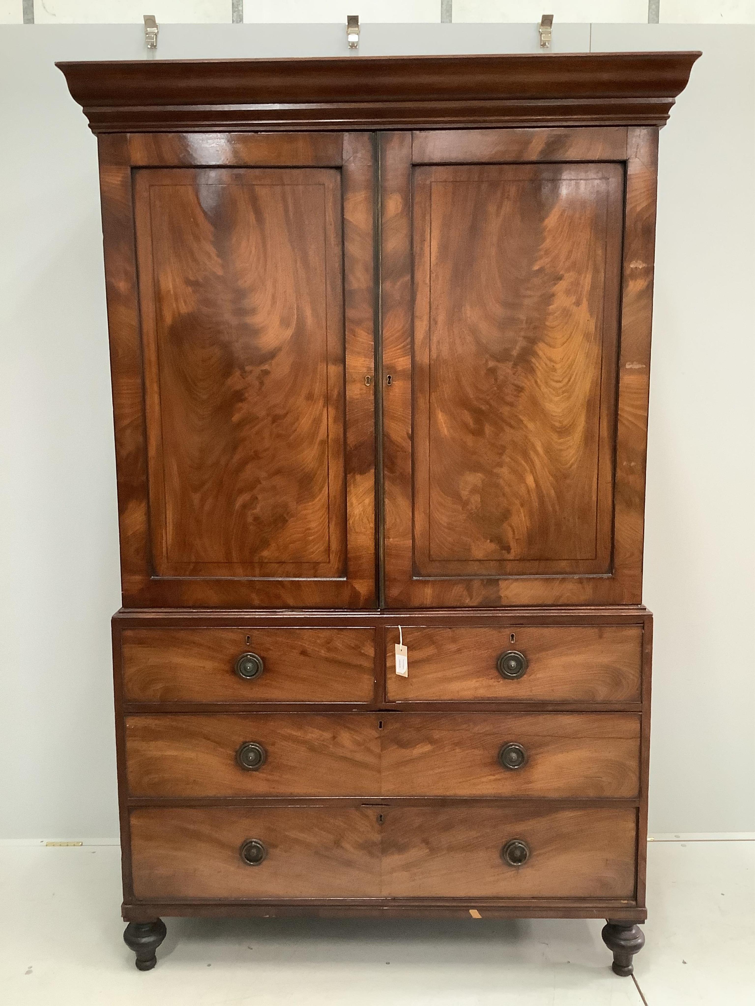 A George IV and later mahogany linen press, width 130cm, depth 60cm, height 205cm. Condition - fair